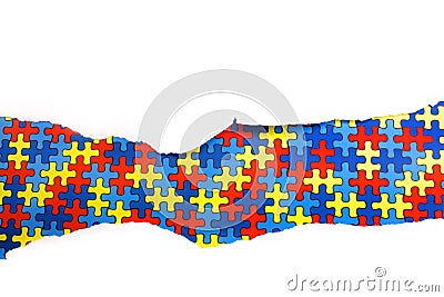 Torn white paper on multicolored puzzle background. Cocept for autism awareness day. Break barriers together for autism. Stock Photo