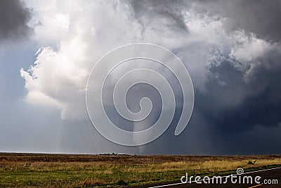 Tornado spins across a field near Ensign, Kansas. Stock Photo