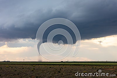Tornado and wall cloud beneath a severe storm Stock Photo