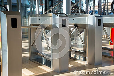 The turnstile is a control system that allows the passage of one person at a time Stock Photo