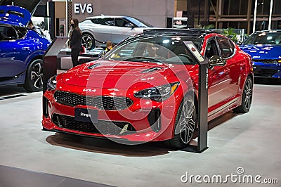 Toronto, Canada - 02 25 2023: California Red Kia Stinger mid-size liftback fastback sports sedan displayed on 2023 Editorial Stock Photo