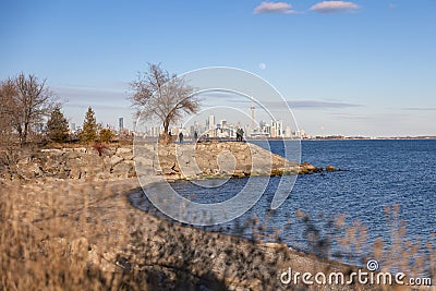 Full moon rising over the Toronto skyline seen from Humber Bay Park. Editorial Stock Photo