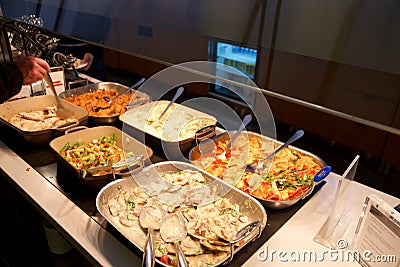 TORONTO, CANADA - JAN 28th, 2017: Air Canada Maple Leaf Lounge at YYZ airport International, eating area with a buffet Editorial Stock Photo