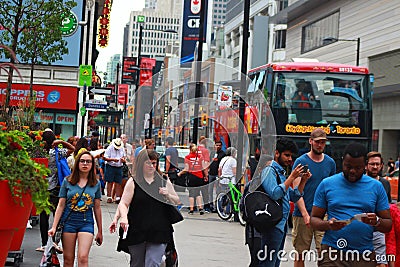 Toronto, Canada- July 07, 2018 Red double-decker sightseeing tour bus driving trough downtown in the city Editorial Stock Photo