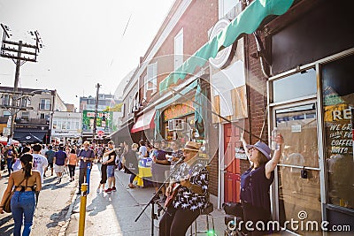 TORONTO, ON, CANADA - JULY 29, 2018: Street view of the crowd at Kensington market in Toronto. Editorial Stock Photo