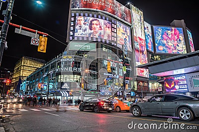 People and -Cars in Yonge-Dundas Square at Night. Totonto, Ontario Editorial Stock Photo