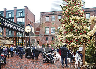 TORONTO, CANADA - NOVEMBER 18, 2017: People visit Christmas market in Distillery Historic District, one of the Toronto`s favourite Editorial Stock Photo