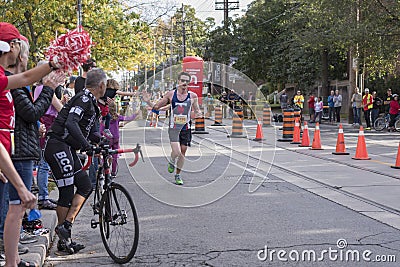 TORONTO, ON/CANADA - OCT 22, 2017: Marathon runner Nate passing Editorial Stock Photo