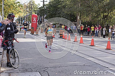 TORONTO, ON/CANADA - OCT 22, 2017: Marathon runner Tanis passing Editorial Stock Photo