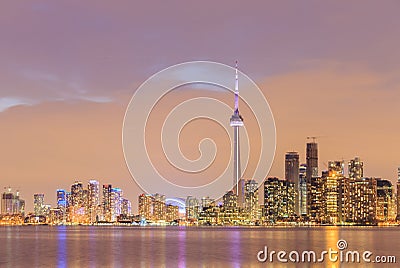 Toronto city dusk over lake with colorful light Stock Photo