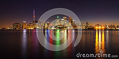 Toronto cityscape panorama at dusk over lake with colorful light Editorial Stock Photo