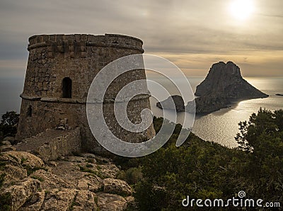 Torre des Savinar tower and Es Vedra island sunset view Stock Photo