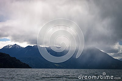 Torrential rain over the Todos los Santos lake All Saints lake, near Puerto Varas, in the Vicente Perez Rosales National Park, Stock Photo