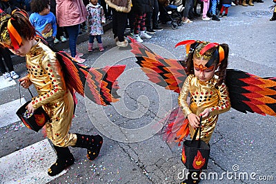 TORREVIEJA, SPAIN, FEBRUARY 12, 2023: Kids in a colorful carnival costumes at a festive parade, Alicante, Costa blanca region. Editorial Stock Photo