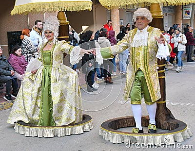 TORREVIEJA, SPAIN FEBRUARY 12, 2023: Participants dressed in a colorful carnival costumes on the street during the traditional Editorial Stock Photo