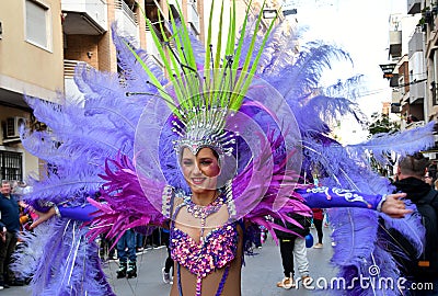 TORREVIEJA, SPAIN FEBRUARY 12, 2023: Participants dressed in a colorful carnival costumes on the street during the traditional Editorial Stock Photo