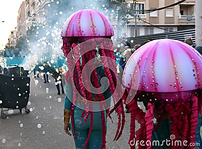 TORREVIEJA, SPAIN FEBRUARY 12, 2023: Participants dressed in a colorful carnival costumes on the street during the traditional Editorial Stock Photo
