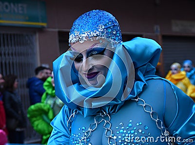 TORREVIEJA, SPAIN FEBRUARY 12, 2023: Participants dressed in a colorful carnival costumes on the street during the traditional Editorial Stock Photo