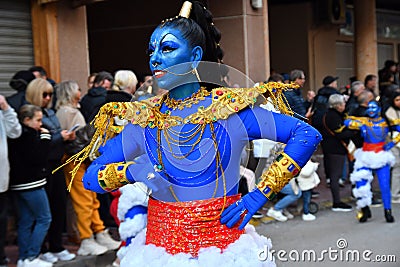 TORREVIEJA, SPAIN FEBRUARY 12, 2023: Participants dressed in a colorful carnival honeybee costumes on the street during the Editorial Stock Photo