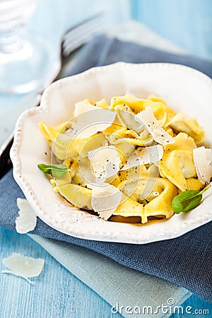 Tortellini with grana padano cheese Stock Photo