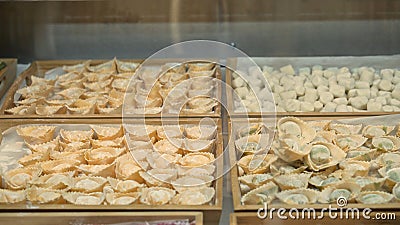 Tortellini on wooden trays at the italian restaurant kitchen Stock Photo