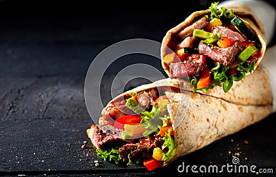 Tortilla wraps with tender entrecote beef steak Stock Photo