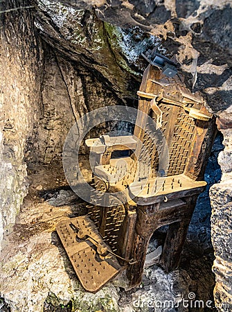 Torture with chair in medieval Ogrodzieniec Castle in Podzamcze village in Silesia region of Poland Editorial Stock Photo
