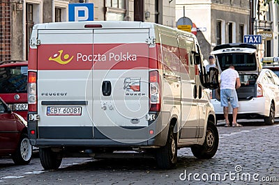 Peugeot Boxer van of Poczta Polska post office in Poland delivering packages Editorial Stock Photo