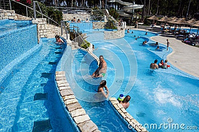 Torvaianica, Italy - July 2017: People having fun in the swimming pool in water park at Zoomarine acqua park Editorial Stock Photo