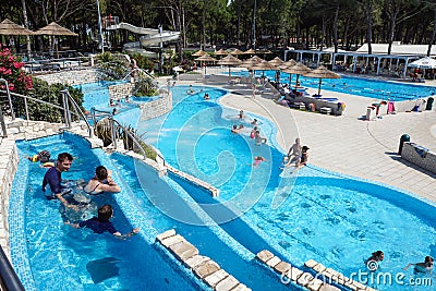 Torvaianica, Italy - July 2017: People having fun in the swimming pool in water park at Zoomarine acqua park Editorial Stock Photo