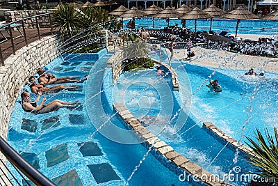 Torvaianica, Italy - July 2017: People having fun in the swimming pool in water park at Zoomarine acqua park Editorial Stock Photo