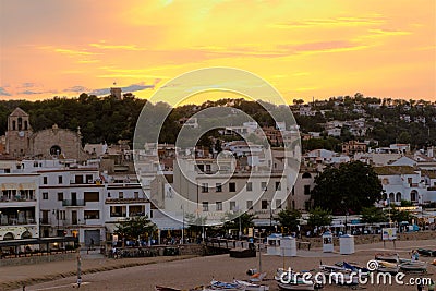Tossa de Mar, Spain, August 2018. Sunset over the seaside town, view from the beach. Editorial Stock Photo
