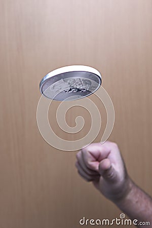 Tossing up a silver coin. Editorial Stock Photo
