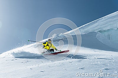 The total length of skiing on fresh snow powder. Professional skier outside the track on a sunny day Stock Photo