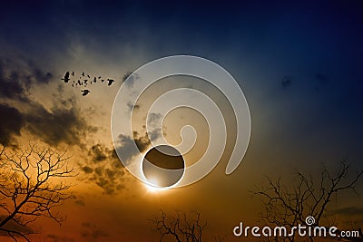 Total solar eclipse in dark red glowing sky Stock Photo