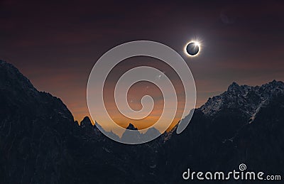 Total solar eclipse over high mountains, amazing dark mysterious scientific image Stock Photo