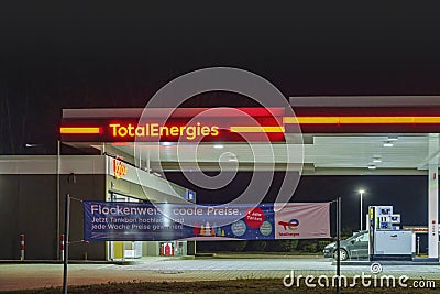 A TotalEnergies gas station at night Editorial Stock Photo