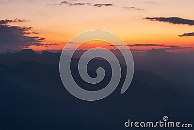Calm and moody mountain sunrise Stock Photo