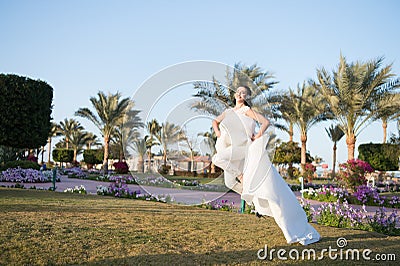 Totally happy. Bride luxury white wedding dress sunny day tropic nature background. Tropic wedding. Woman happy pretty Stock Photo
