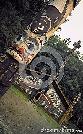 Totem Poles and Clan House Stock Photo