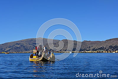 A Totora boat floating on the Titicaca lake, in Peru Editorial Stock Photo