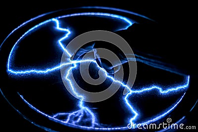 Touch the finger to the gas-discharge lamp. Stock Photo