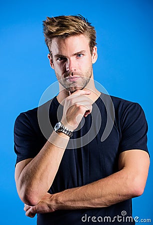 Touching his perfect beard. Unshaven guy. fashion model. Casual style. Mens sexuality. Barbershop concept. Guy in denim Stock Photo