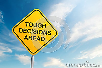 Tough decisions ahead road sign with blue sky and cloud background Stock Photo