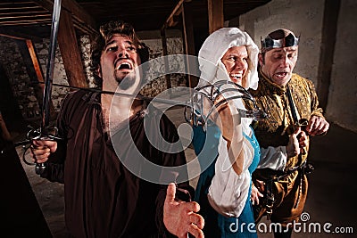 Laughing Lady with Sword on Man Stock Photo