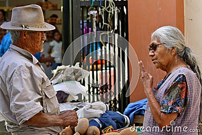 Tough negotiation at mexican market Editorial Stock Photo