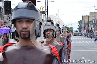 Tough, rude Roman soldier street drama, community celebrates Good Friday representing the events that led to the Crucifixion of Je Editorial Stock Photo