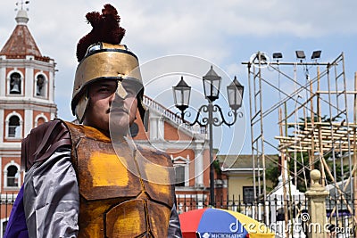 Tough, rude Roman soldier street drama, community celebrates Good Friday representing the events that led to the Crucifixion of Je Editorial Stock Photo