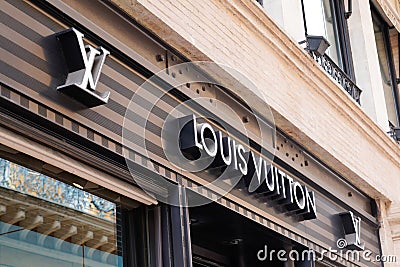 Louis Vuitton logo brand and text sign front of home shop luxe brand handbag and Editorial Stock Photo