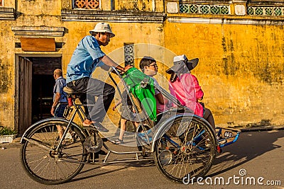 A tour through the ancient old town by cyclo ride, Hoi An, Vietnam - January 10th, 2015 Editorial Stock Photo